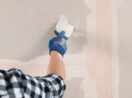 Closeup of a man's hands, handcuffed behind his back